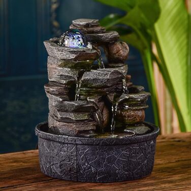 Джерело води Zen'Light від Zimmerbrunnen: природний водоспад з ефектом каменів та кольоровим LED-підсвічуванням. Ідеальна декор для дому, медитації та релаксації. Об'єкт Фен-Шуй для щастя. Висота 23 см (Satya)