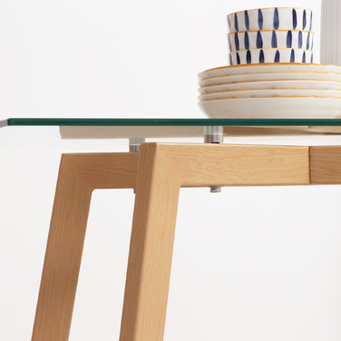 Обідній стіл на 4 особи, зі скляною стільницею, сталевим каркасом та імітацією дерев'яної текстури, розміром 120 см (довжина) x 60 см (ширина) x 76 см (висота)