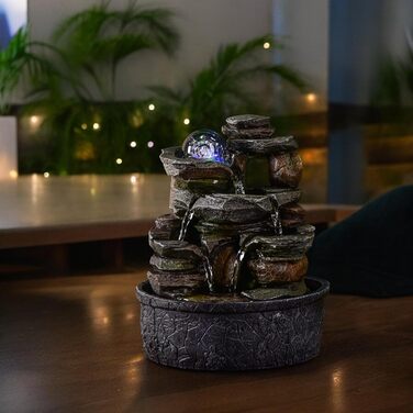 Джерело води Zen'Light від Zimmerbrunnen: природний водоспад з ефектом каменів та кольоровим LED-підсвічуванням. Ідеальна декор для дому, медитації та релаксації. Об'єкт Фен-Шуй для щастя. Висота 23 см (Satya)