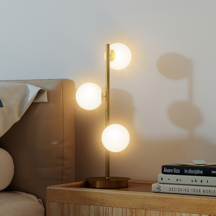 Настільна лампа з трьома сферичними плафонами, міцний сталевий постамент, патрони G9, розміри 24 x 24 x 53 см, латунь.